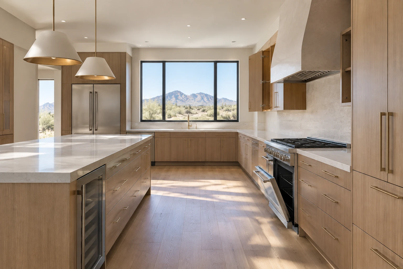 Empty kitchen with bare counters, white oak cabinets and a stainless range